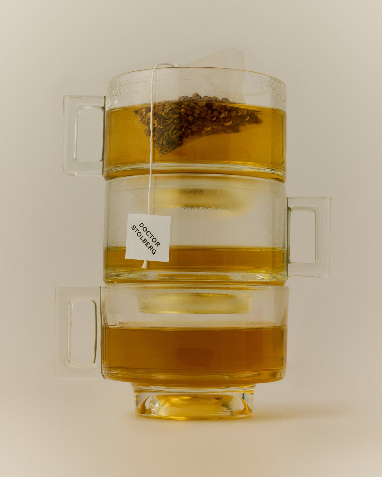 Rest + Digest Tea steeping in stacked glass tea cups